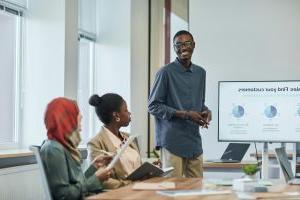 Students in a conference room watching a presentation